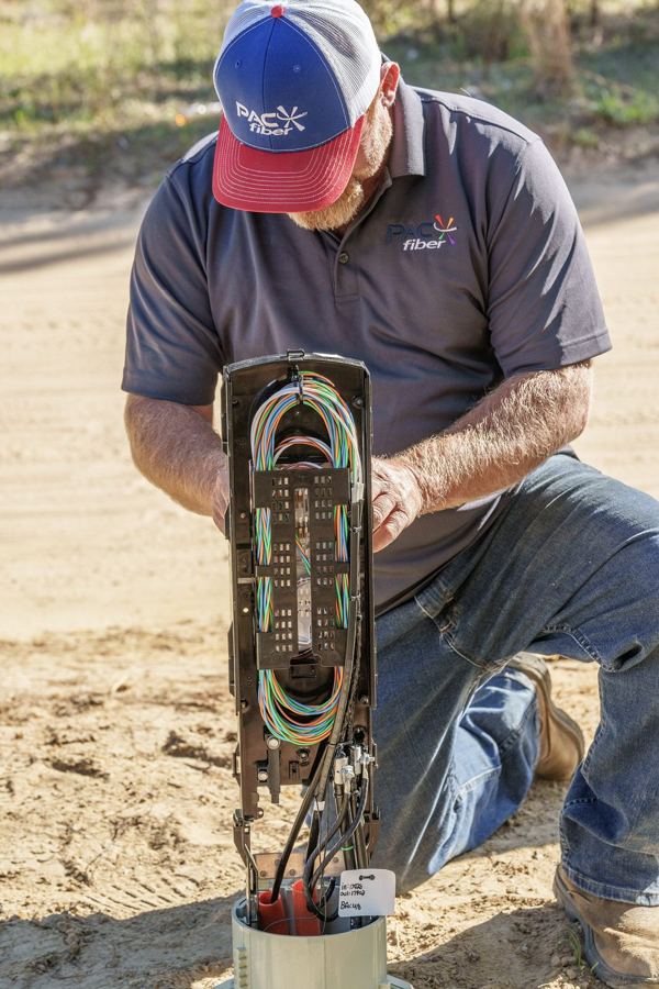 Fiber splice closure inside a pedestal